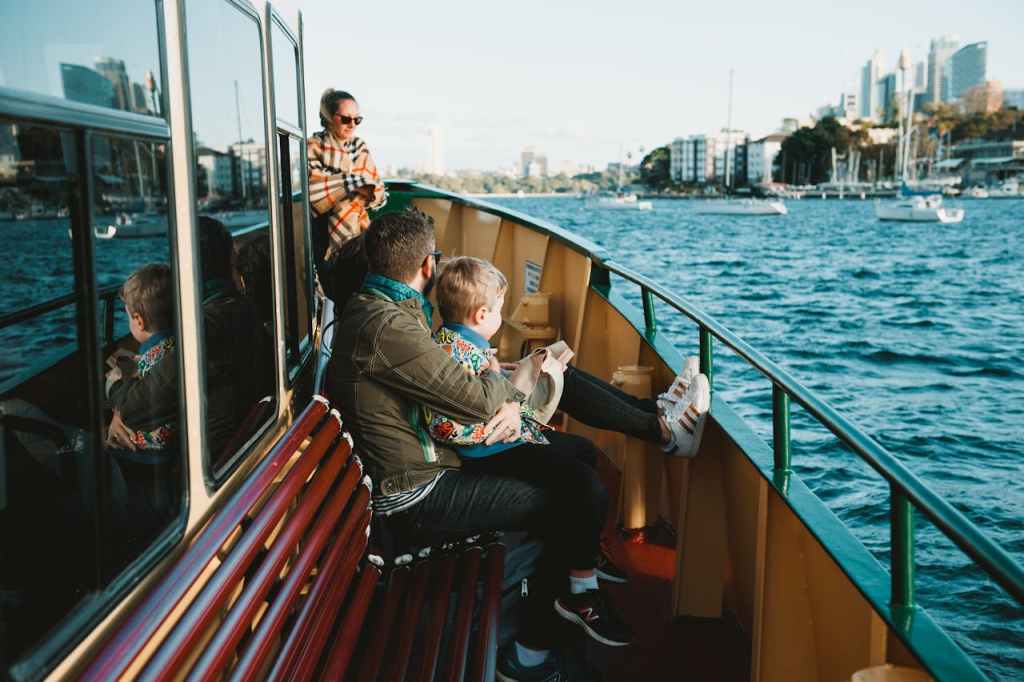 family of mother, dad and son on Sydney Harbour Ferry